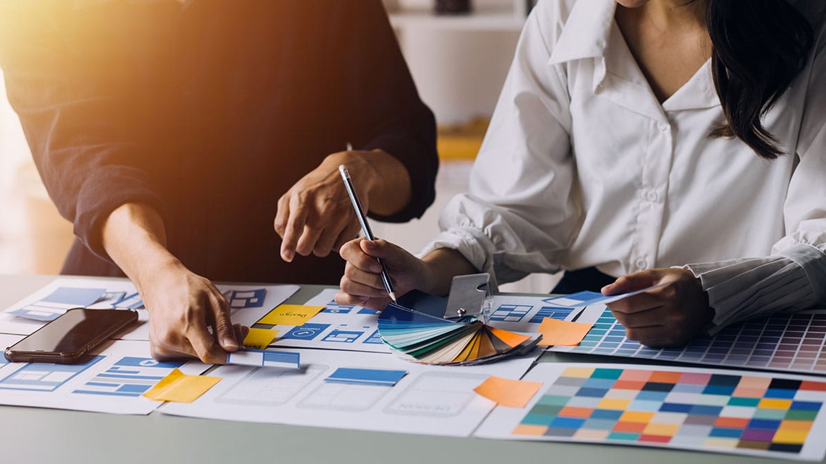 Two designers working on UX/UI web design